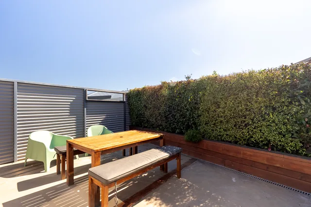 Sunny private courtyard with outdoor table