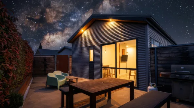 Front Cottage and its private courtyard beneath the night sky