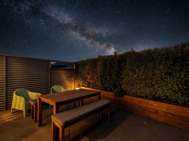 Front Cottage courtyard and outdoor seating at night